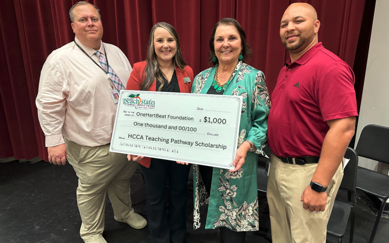 Pictured from left to right are Hart County High School Principal Kevin Gaines, Peach State Federal Credit Union representative Brooke Westbrook, OneHartBeat Foundation Director Bobbie Busha, and Hart College and Career Academy CEO Steve Burton.