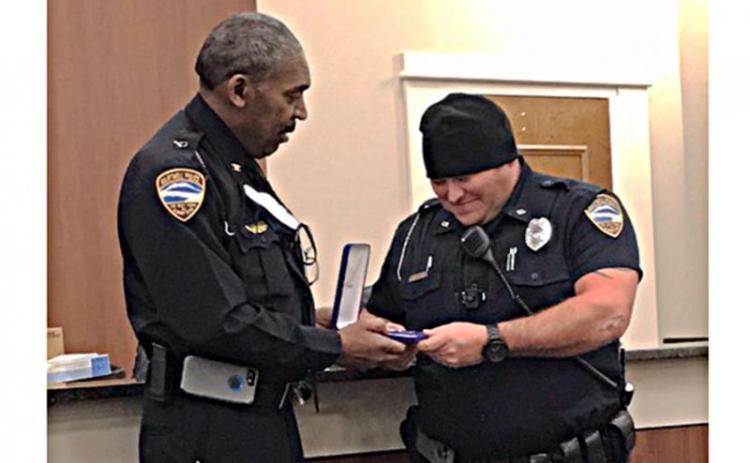 Archived photo Hart County police chief Anthony Davis, left, presents officer Matthew Dutton with the department’s Medal of Valor in February for his response to a murder in January.
