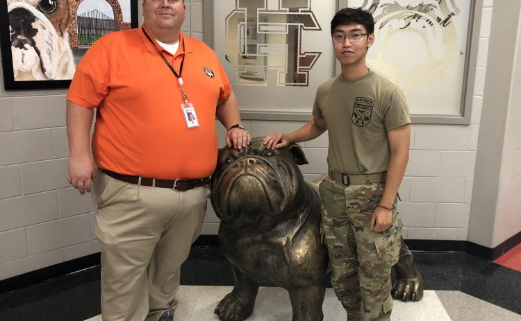 Hart County High School principal Kevin Gaines stands alongside star student Francis Hoang who was recently named as the school’s representative to the state superintendant’s student advisory council.