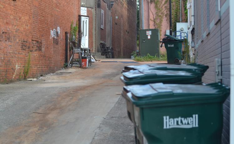 Constitution alley between Depot and Howell streets, seen above, has an untick in trash accumulation in recent years that the city and businesses are working to eliminate.
