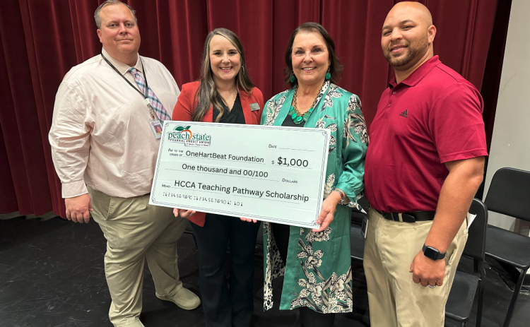 Pictured from left to right are Hart County High School Principal Kevin Gaines, Peach State Federal Credit Union representative Brooke Westbrook, OneHartBeat Foundation Director Bobbie Busha, and Hart College and Career Academy CEO Steve Burton.
