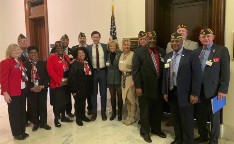 Senator Jon Ossoff with representatives from Veterans of Foreign Wars in 2023.