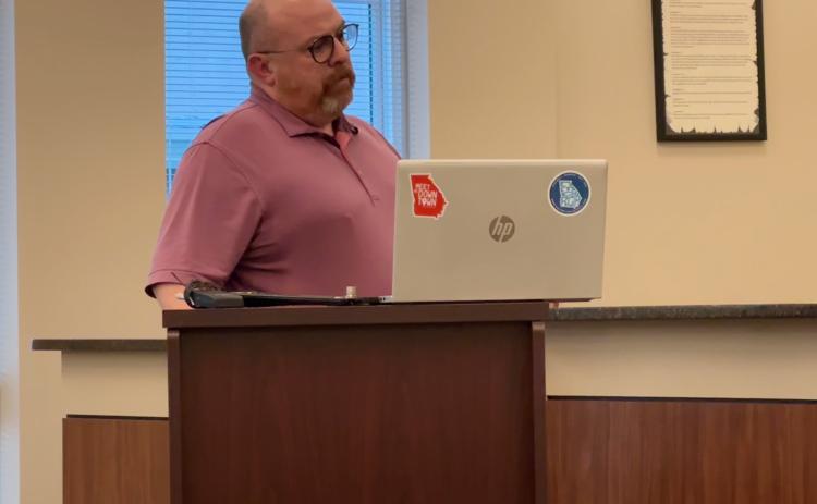 Downtown Development Authority and Hartwell Main Street Director Jason Ford discusses annexation at the city council meeting March 4.