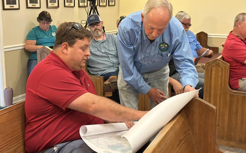 Hartwell city manager Jon Herschell and Hart County Water and Sewer Authority Director Pat Goran looking over a service delivery map.
