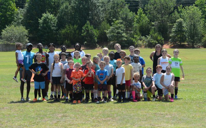 Pictured are the 30 campers along with the six coaches who helped coach and learn during the FUNdamentals Soccer Camp at the Bell Family YMCA on June 10-14.
